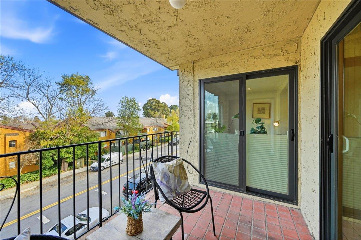 555 Palm Avenue, Unit 202 Millbrae, CA 94030 - Photo 28 of 40 a view of a balcony with chair and the potted plant