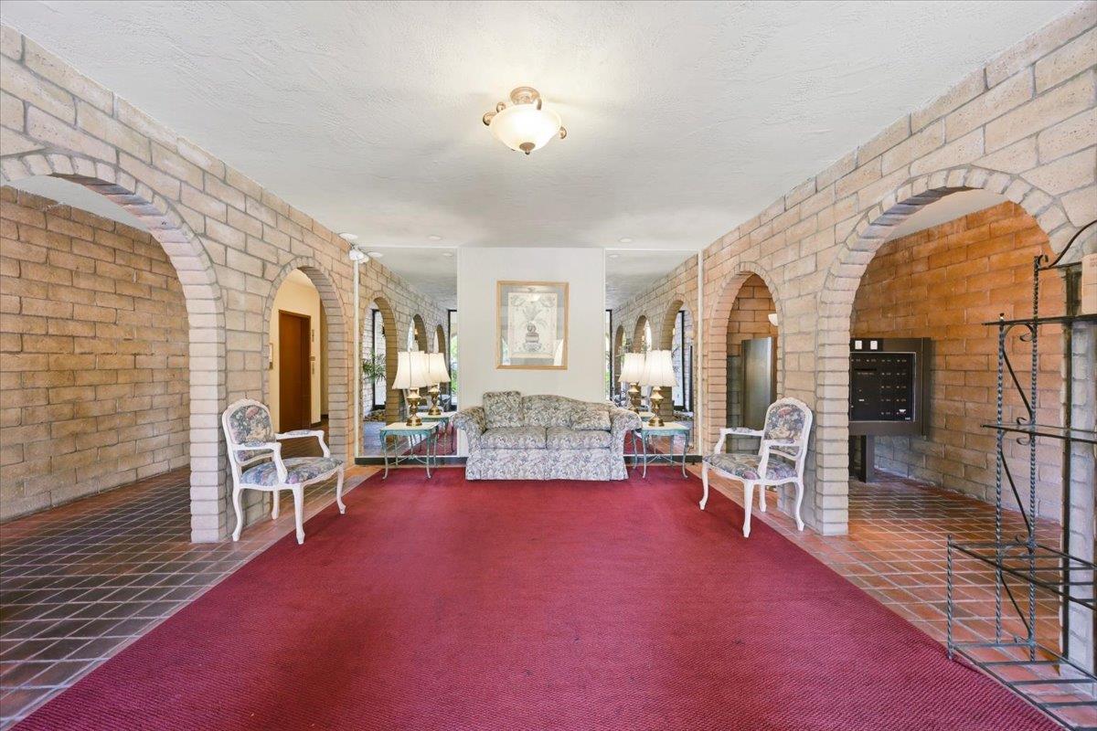 555 Palm Avenue, Unit 202 Millbrae, CA 94030 - Photo 5 of 40 a living room with furniture and a fireplace