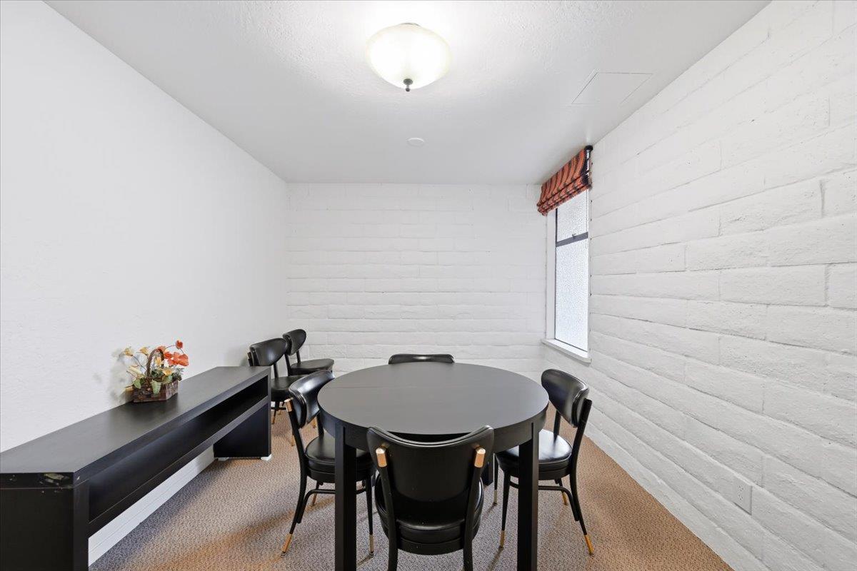 555 Palm Avenue, Unit 202 Millbrae, CA 94030 - Photo 9 of 40 a dining room with furniture and wooden floor