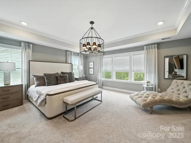 a en suite bathroom with a double vanity sink and a mirror