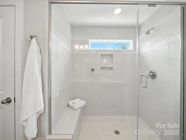 a bathroom with double vanity sinks and a mirror