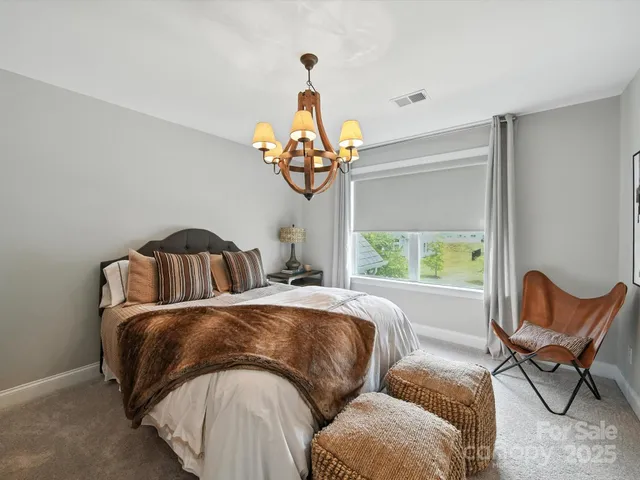a bathroom with a sink toilet vanity and shower