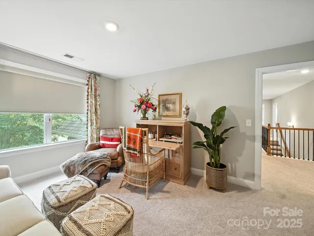 a bathroom with double vanity sinks a large mirror and a shower