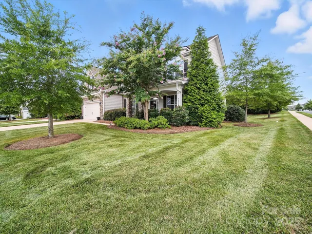 a view of a house with a big yard