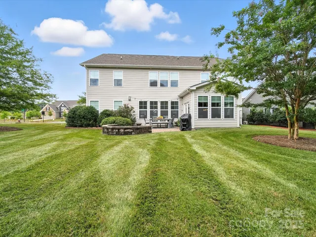 a view of a backyard with sitting area