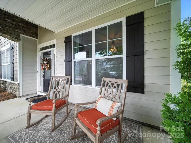 a outdoor living space with furniture and a potted plant