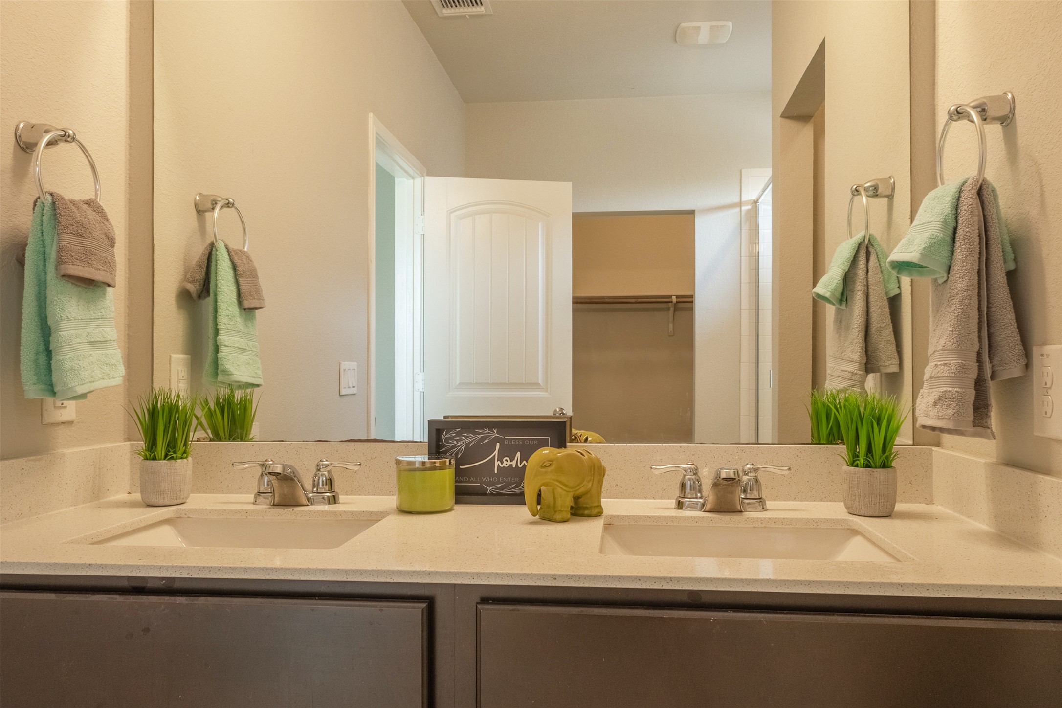 7225 Ranchito Drive Austin, TX 78744 - Photo 12 of 40 Double vanities and ample counter space create a serene and functional bathroom retreat.