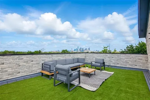 a view of a lake with furniture