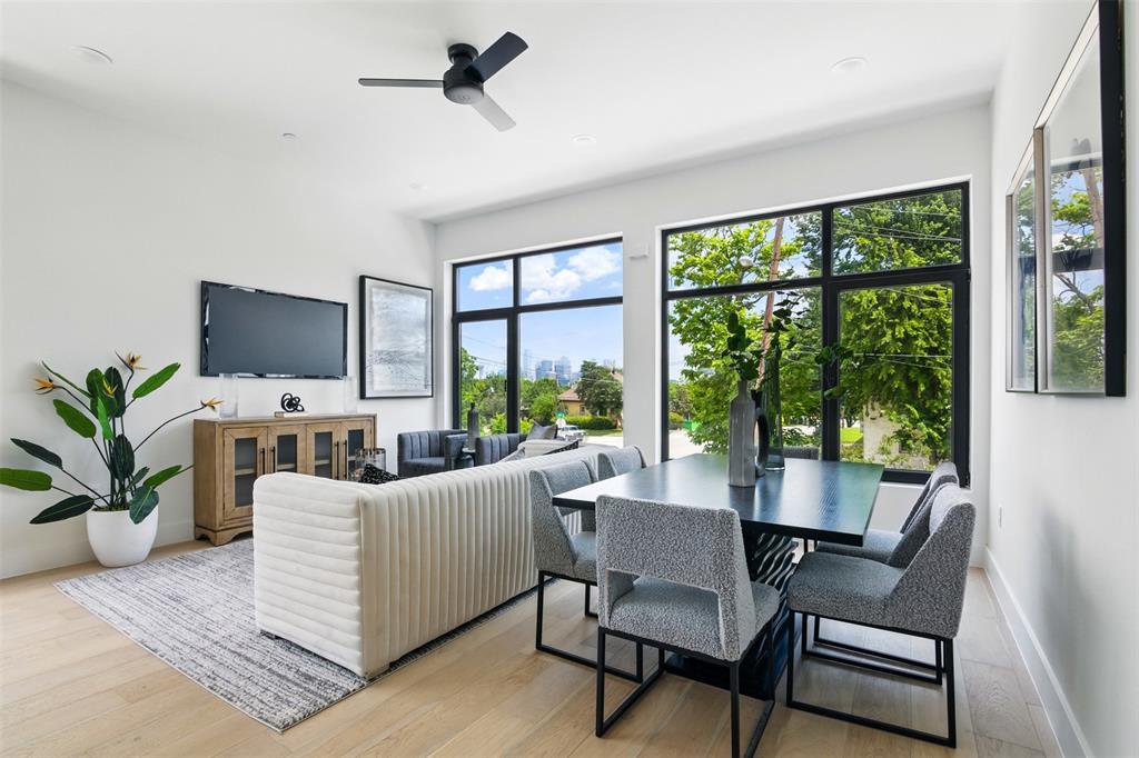430 East 8th Street Dallas, TX 75203 - Photo 9 of 26 a living room with furniture tv and large windows