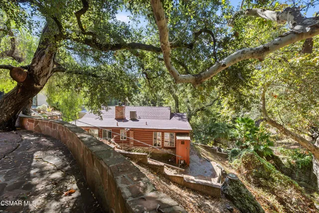 a view of a backyard with sitting area