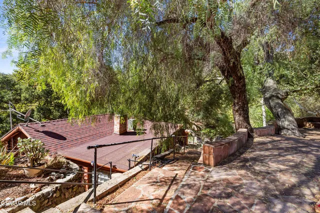 a view of a house with a outdoor space and street view