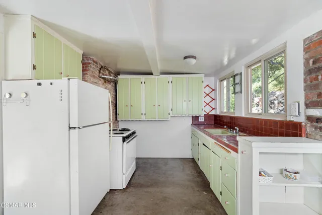 a bathroom with a sink and a window