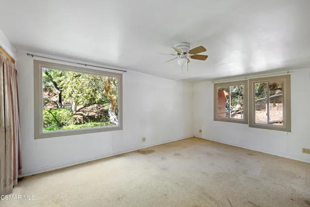 an empty room with windows