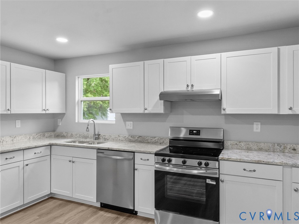 6204 Walderbrook Road Richmond, VA 23234 - Photo 10 of 32 Modern kitchen featuring white shaker cabinetry, s