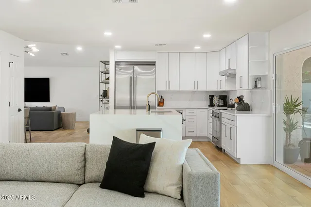 a bedroom with a bed and lamp