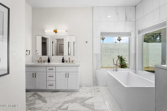 an aerial view of residential houses with outdoor space and river