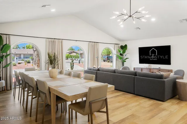 a view of a dining room with furniture and wooden floor