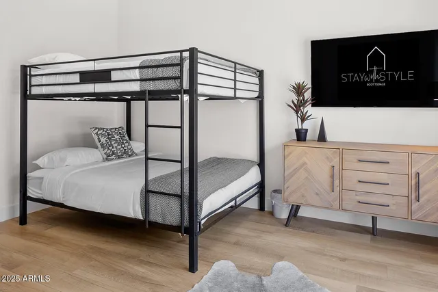 a view of a house with swimming pool and sitting area