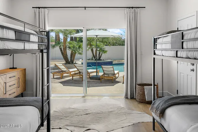 a view of a house with swimming pool and sitting area