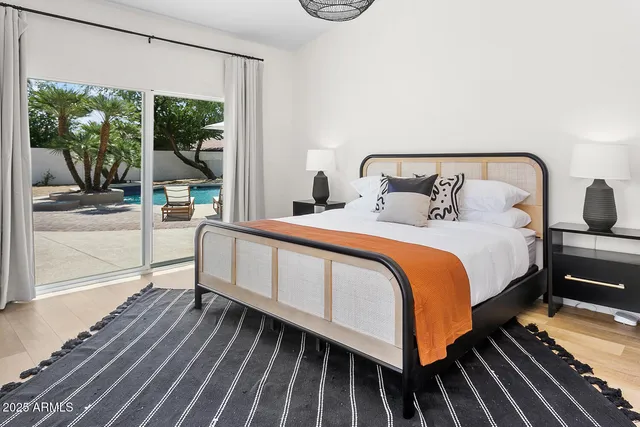 a view of a swimming pool with lounge chairs