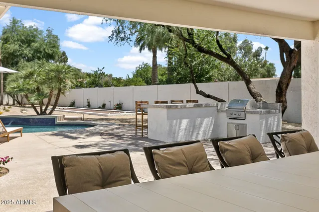 a view of a swimming pool with a lounge chair