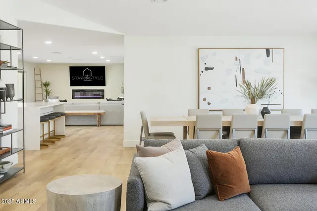 a kitchen with stainless steel appliances kitchen island granite countertop a stove and a sink