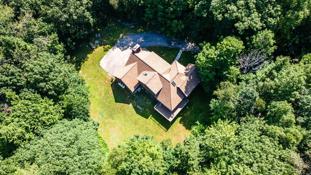 34 Hermit Road Alton, NH 03810 - Photo 2 of 37 an aerial view of a house with swimming pool and outdoor space