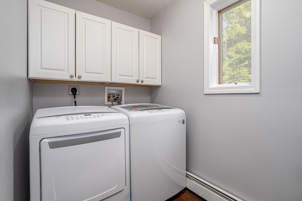 34 Hermit Road Alton, NH 03810 - Photo 21 of 37 a utility room with dryer and washer