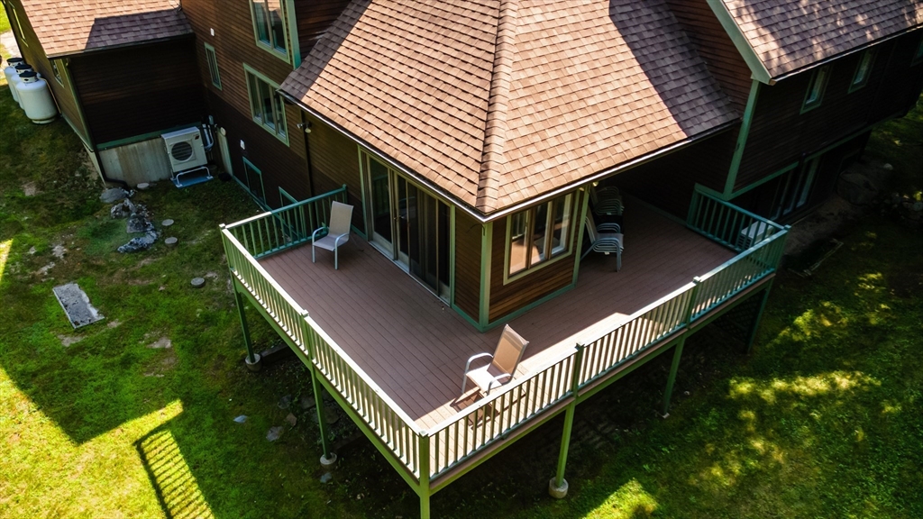 34 Hermit Road Alton, NH 03810 - Photo 31 of 37 a balcony with table and chairs