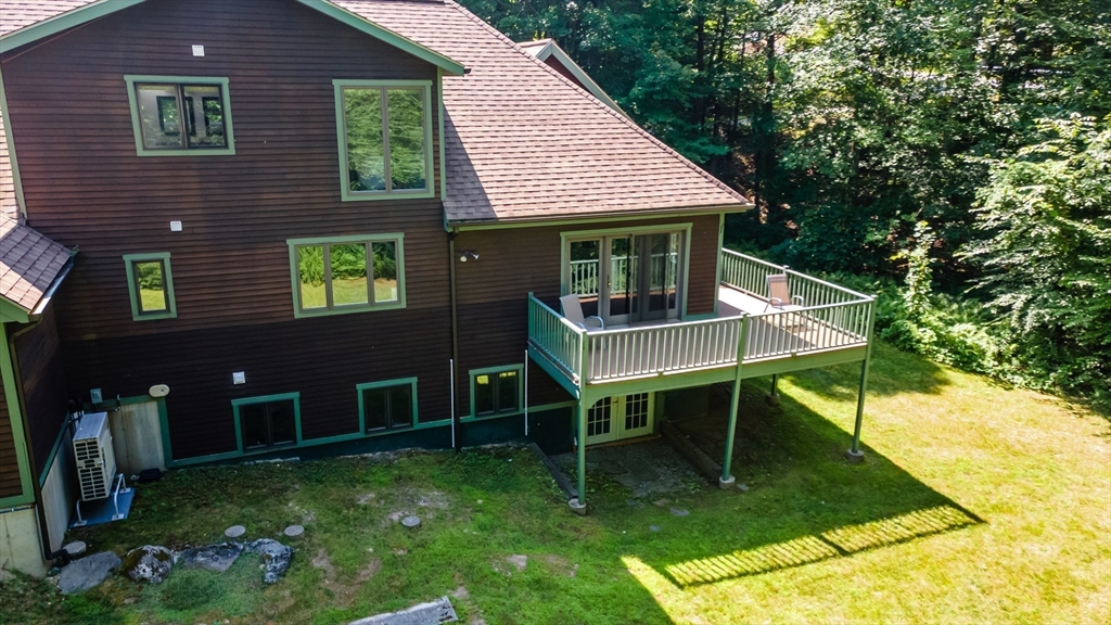 34 Hermit Road Alton, NH 03810 - Photo 36 of 37 a view of a house with backyard porch and sitting area