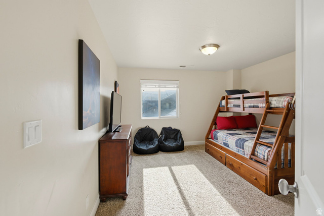 4269 Razor Drive Washington, UT 84780 - Photo 19 of 50 Bedroom with light colored carpet and baseboards