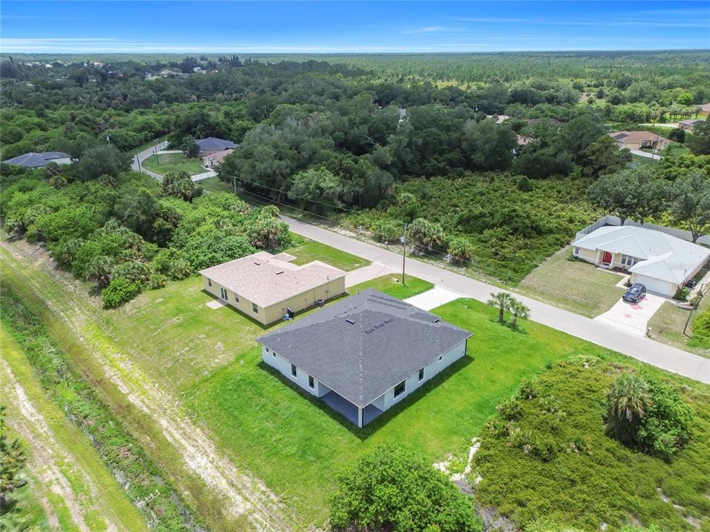 2328 Irondale Road North Port, FL 34287 - Photo 42 of 45 an aerial view of a house with a yard