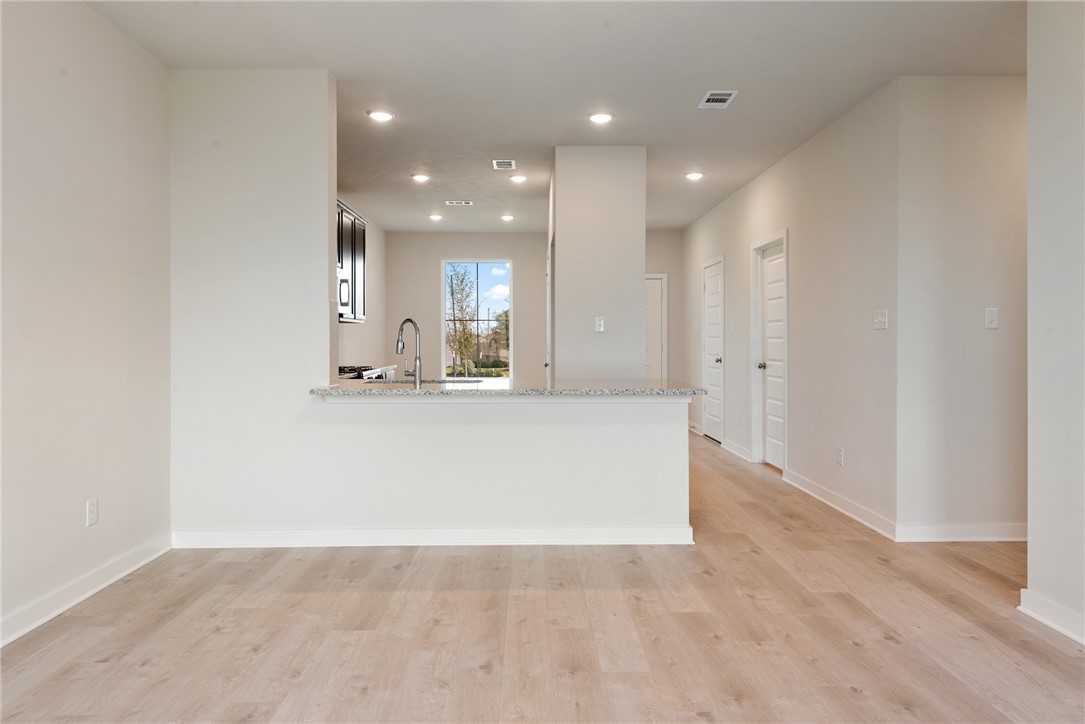 225 Cross Lane Caldwell, TX 77836 - Photo 19 of 38 a view of kitchen island kitchen island and windows