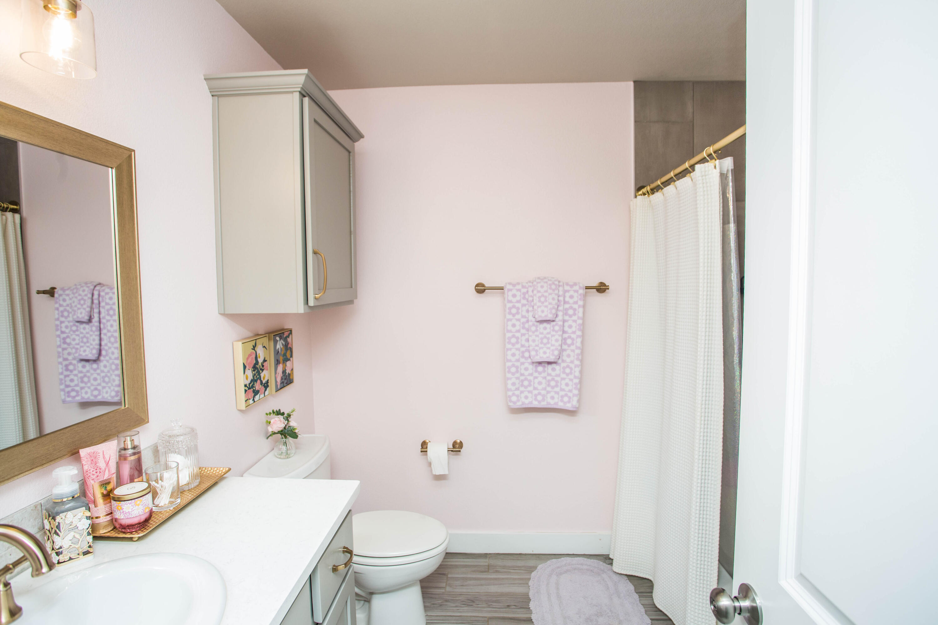 1932 142nd Street Lubbock, TX 79423 - Photo 17 of 38 a bathroom with a granite countertop sink mirror vanity and toilet