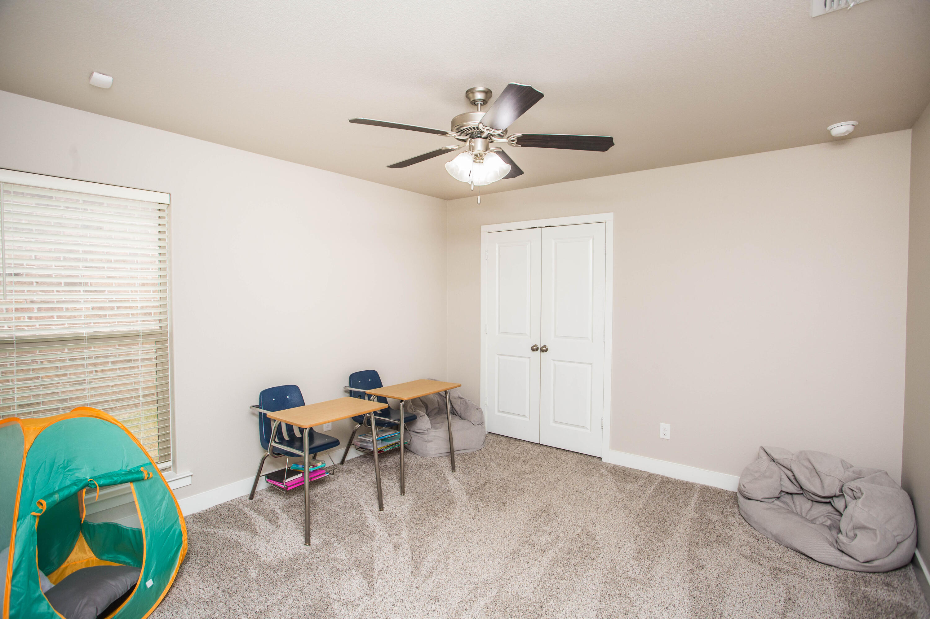 1932 142nd Street Lubbock, TX 79423 - Photo 18 of 38 a view of a workspace with furniture and a window