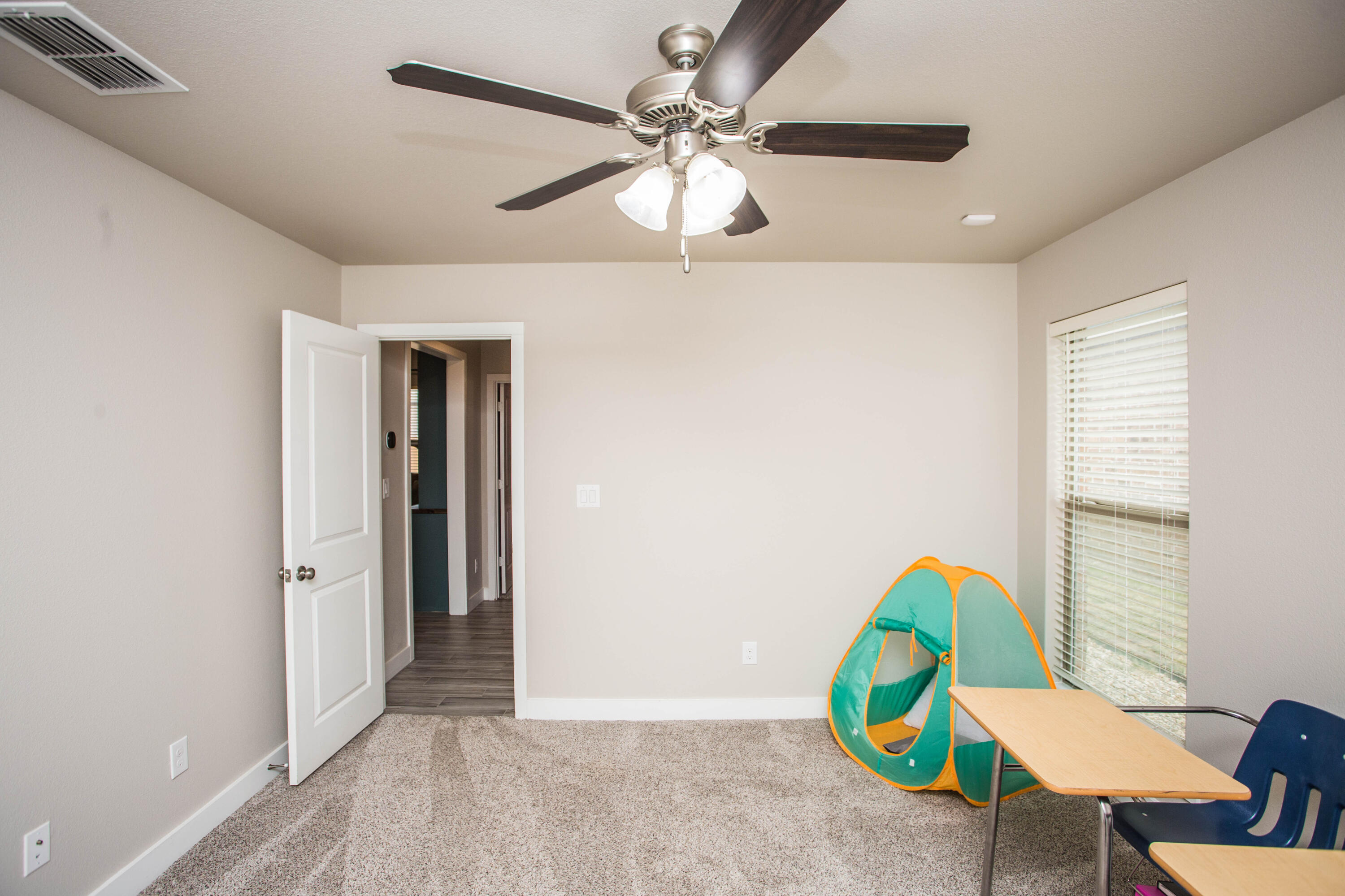 1932 142nd Street Lubbock, TX 79423 - Photo 19 of 38 a view of a livingroom with a window and furniture