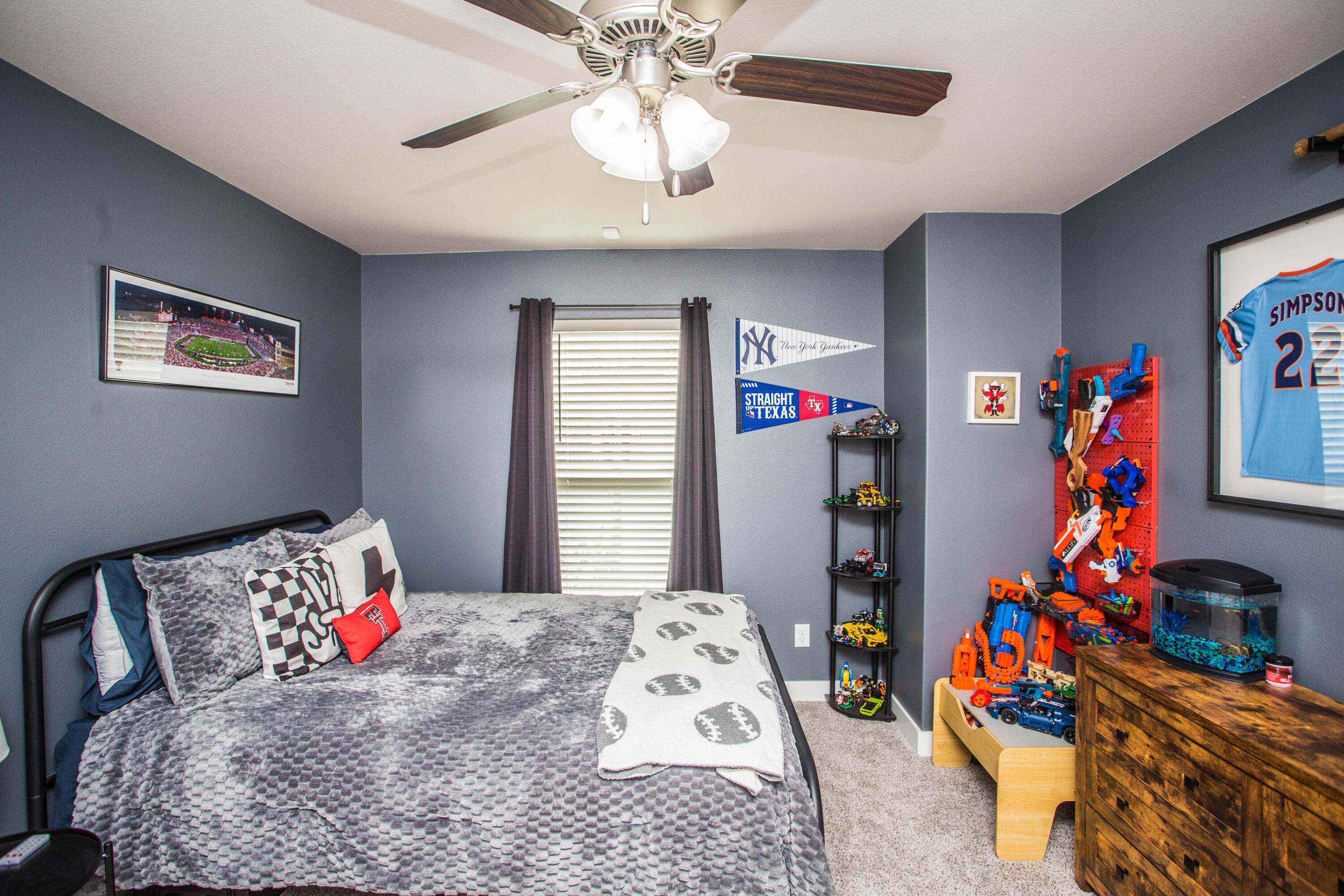 1932 142nd Street Lubbock, TX 79423 - Photo 21 of 38 a bedroom with a bed and a window