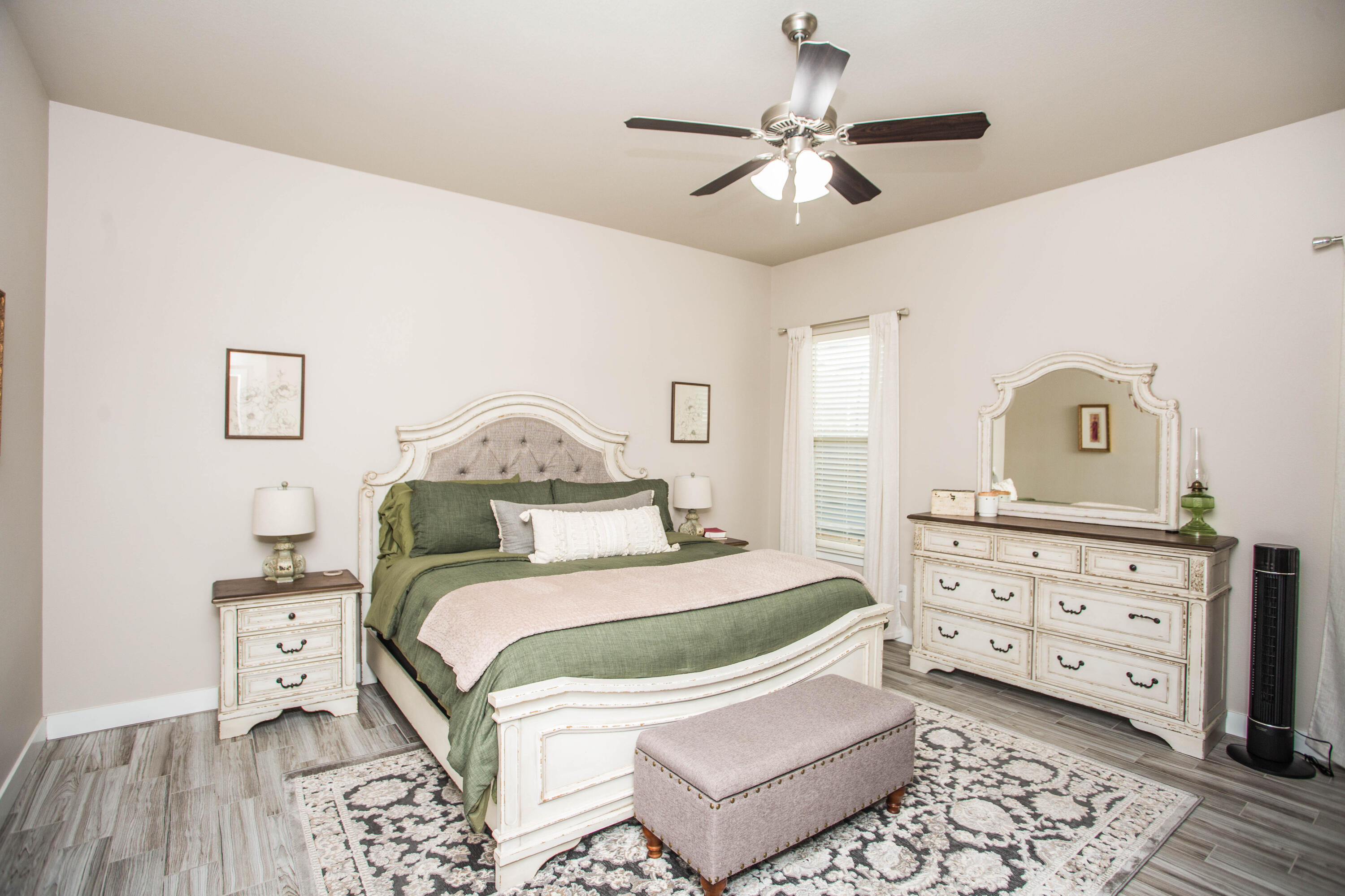 1932 142nd Street Lubbock, TX 79423 - Photo 26 of 38 a bedroom with a bed and a dresser