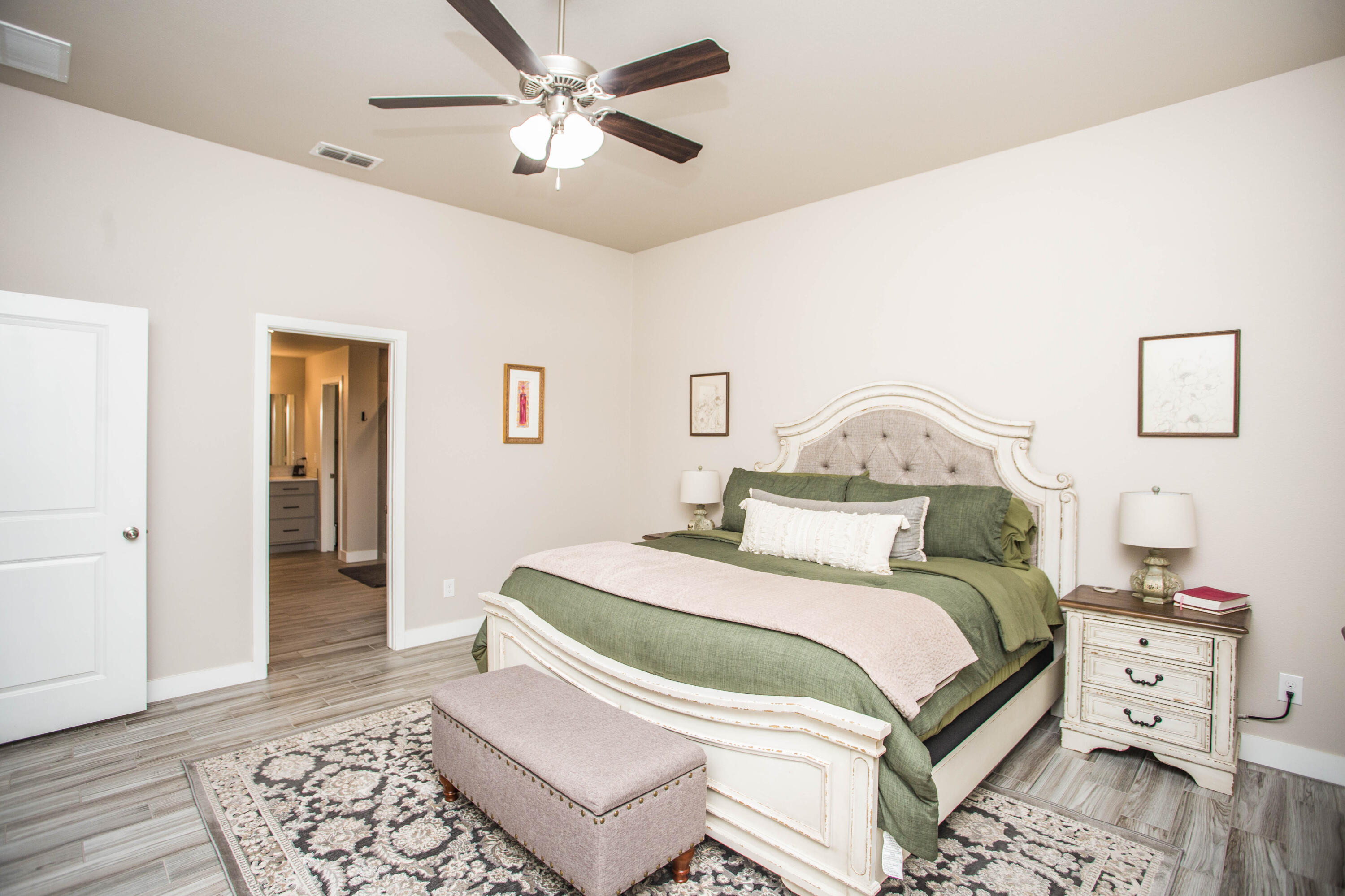 1932 142nd Street Lubbock, TX 79423 - Photo 28 of 38 a bedroom with a bed and wooden floor