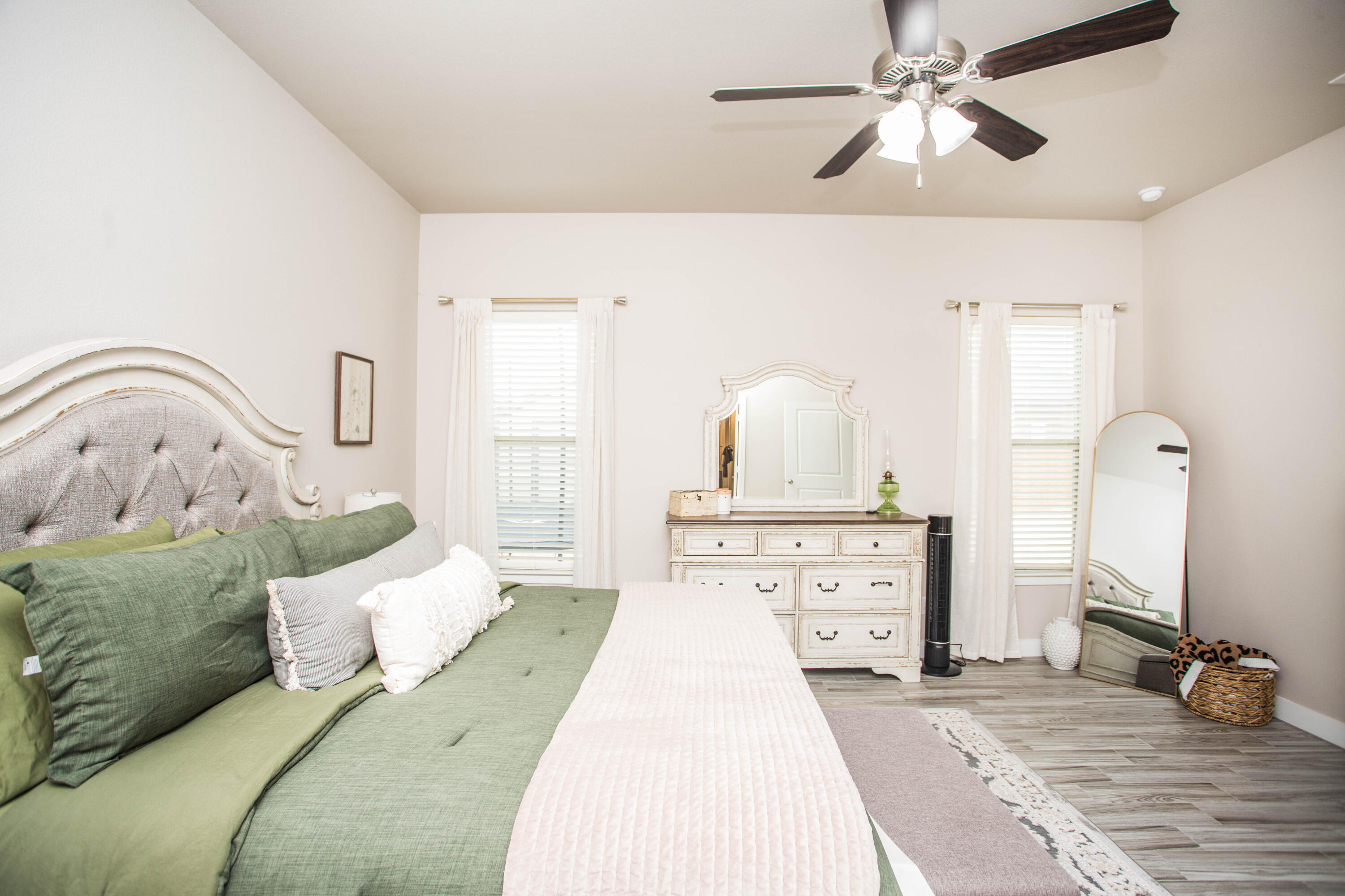 1932 142nd Street Lubbock, TX 79423 - Photo 29 of 38 a bedroom with a bed and a chandelier