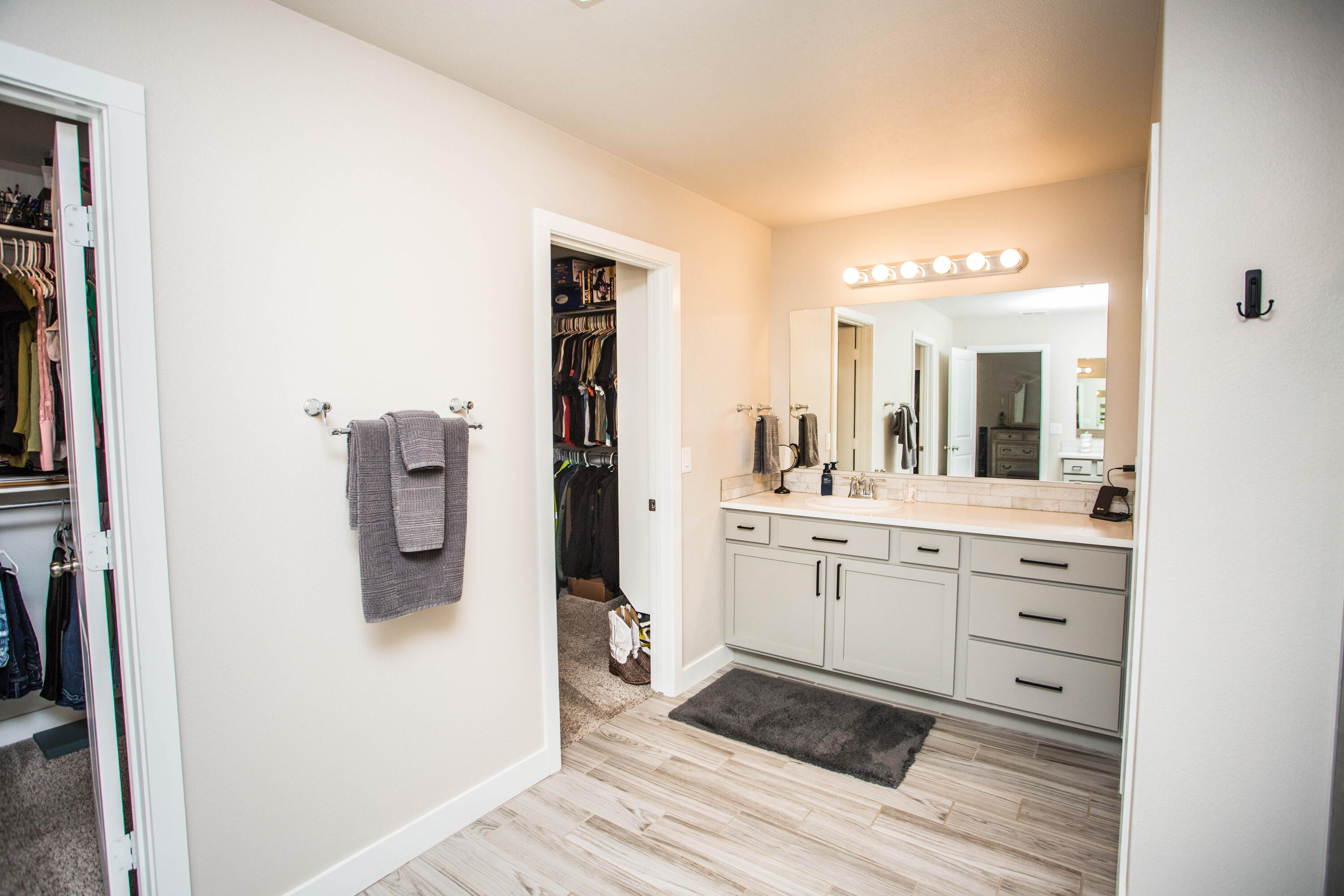 1932 142nd Street Lubbock, TX 79423 - Photo 32 of 38 a spacious bathroom with a shower a sink and a mirror