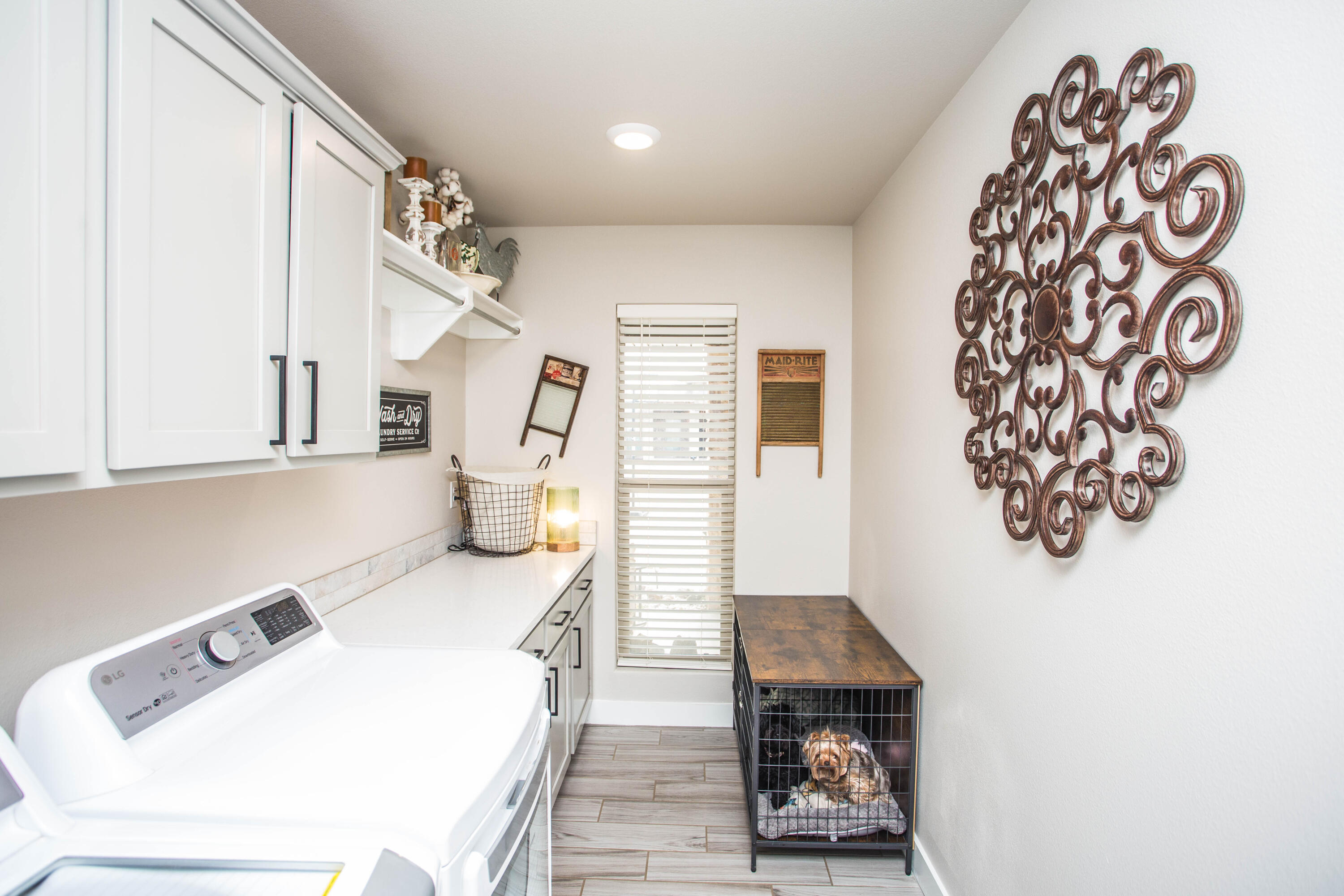 1932 142nd Street Lubbock, TX 79423 - Photo 34 of 38 a living room with a couch and a potted plant