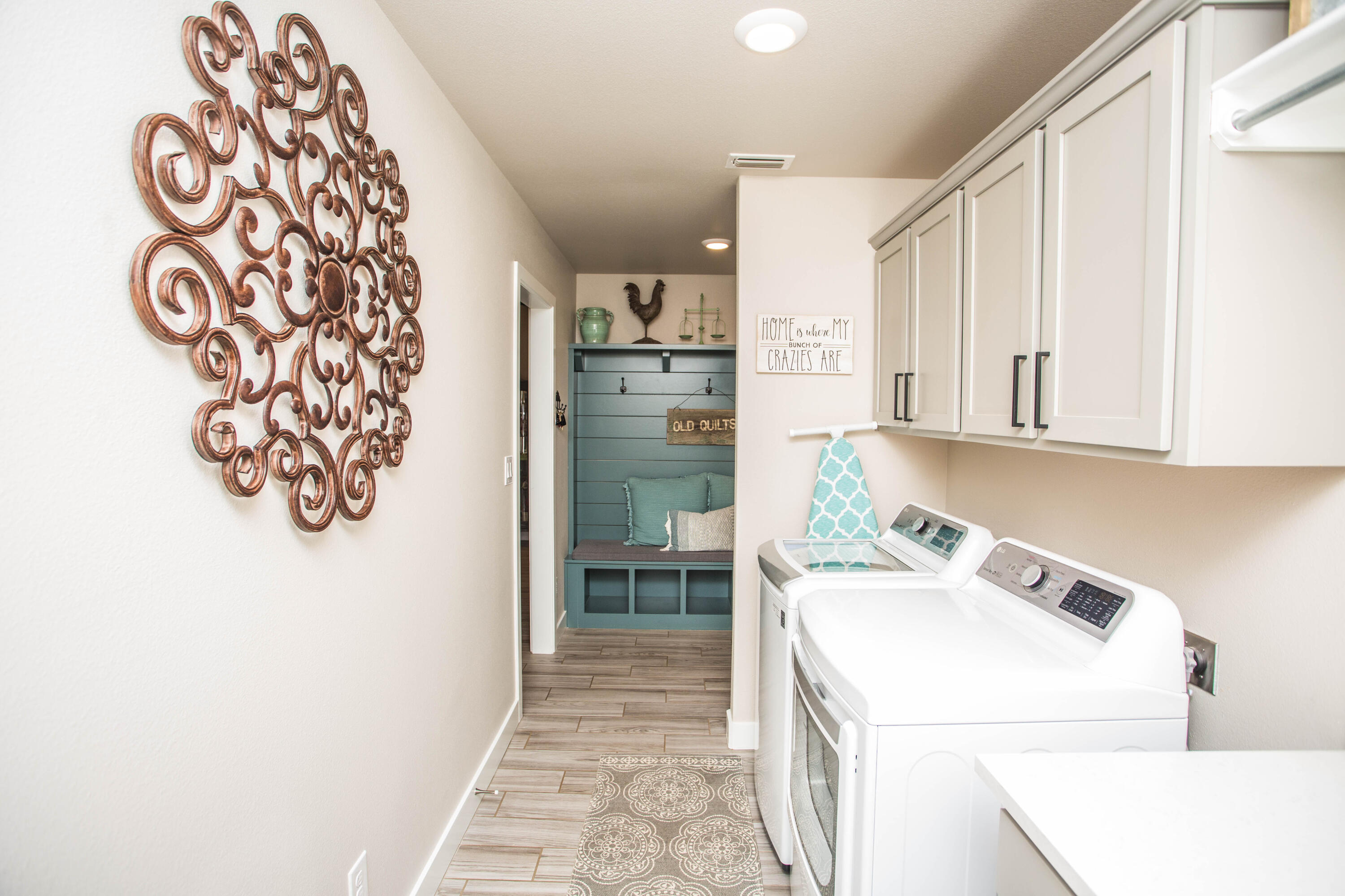 1932 142nd Street Lubbock, TX 79423 - Photo 35 of 38 a utility room with fridge dryer and washer