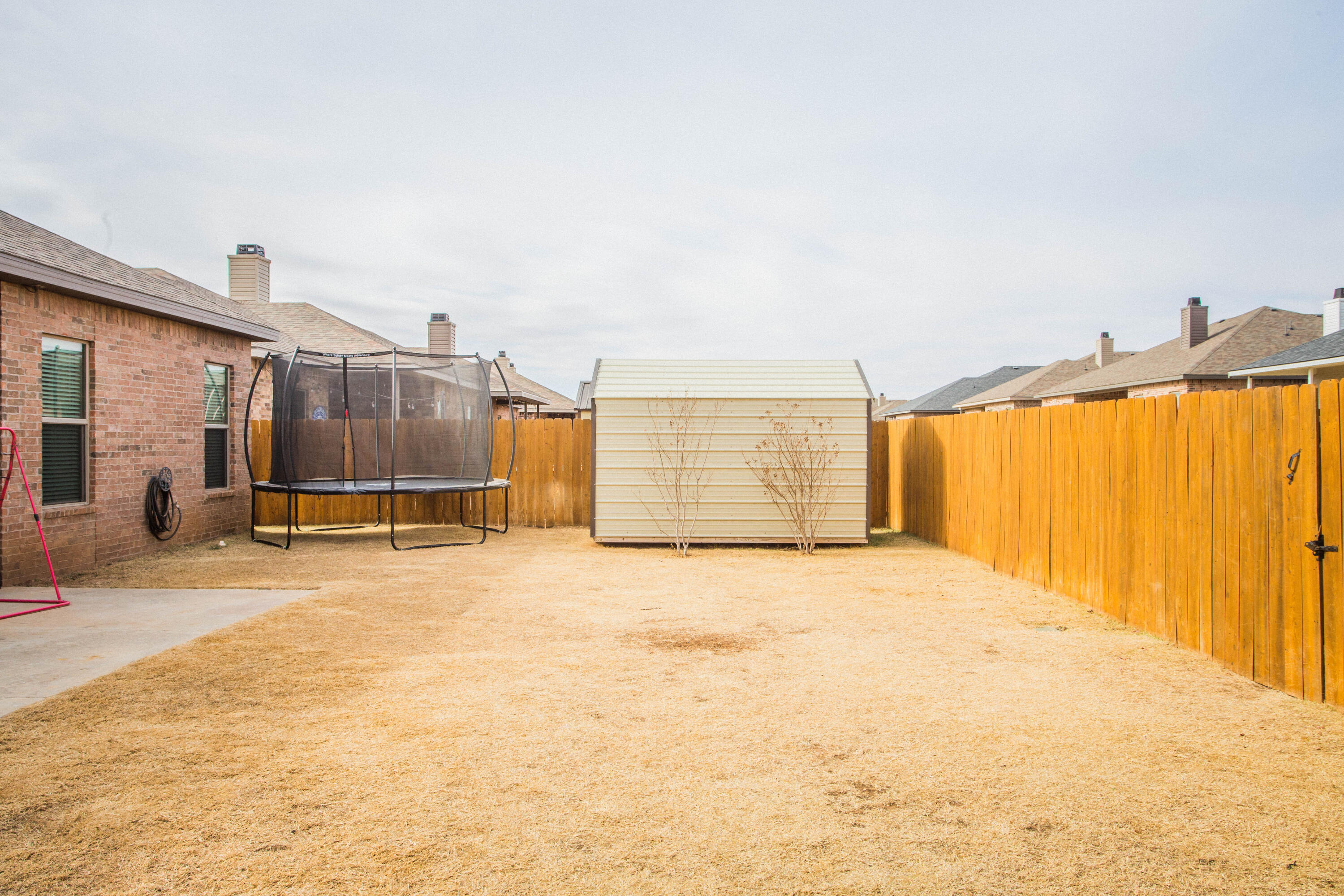 1932 142nd Street Lubbock, TX 79423 - Photo 38 of 38 a view of backyard of a house