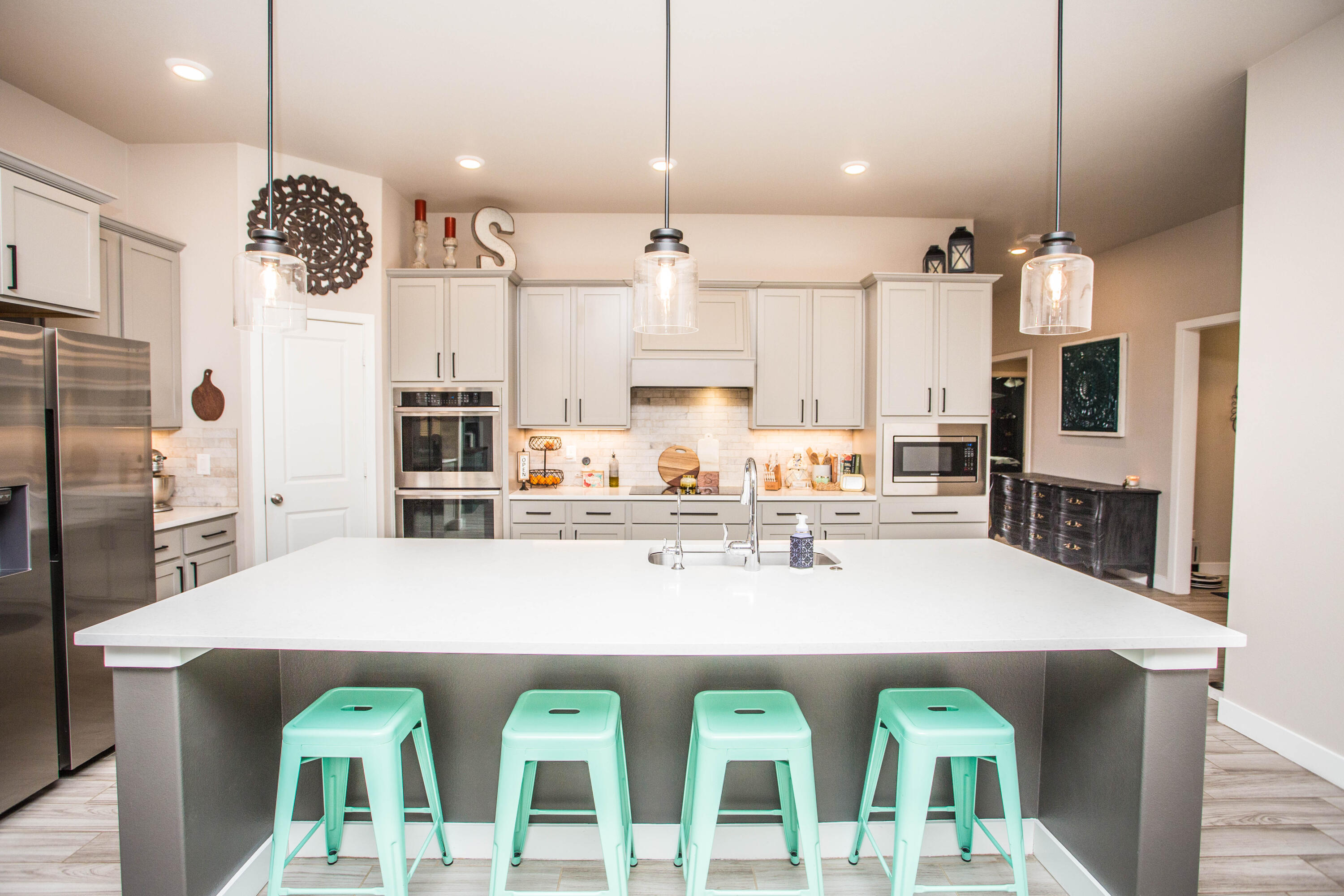 1932 142nd Street Lubbock, TX 79423 - Photo 8 of 38 a large kitchen with lots of counter space and stainless steel appliances