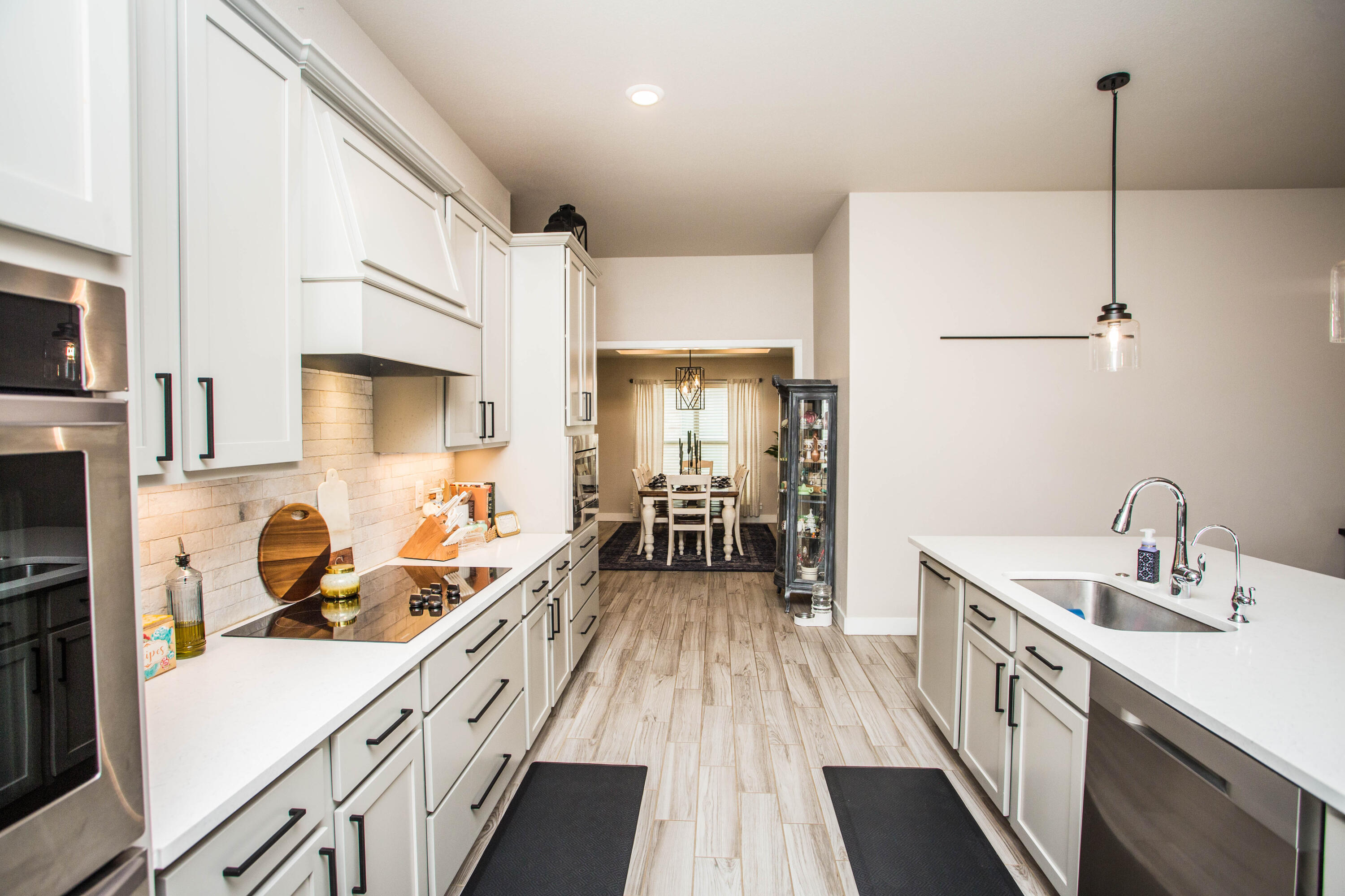 1932 142nd Street Lubbock, TX 79423 - Photo 9 of 38 a kitchen with a sink stove and refrigerator