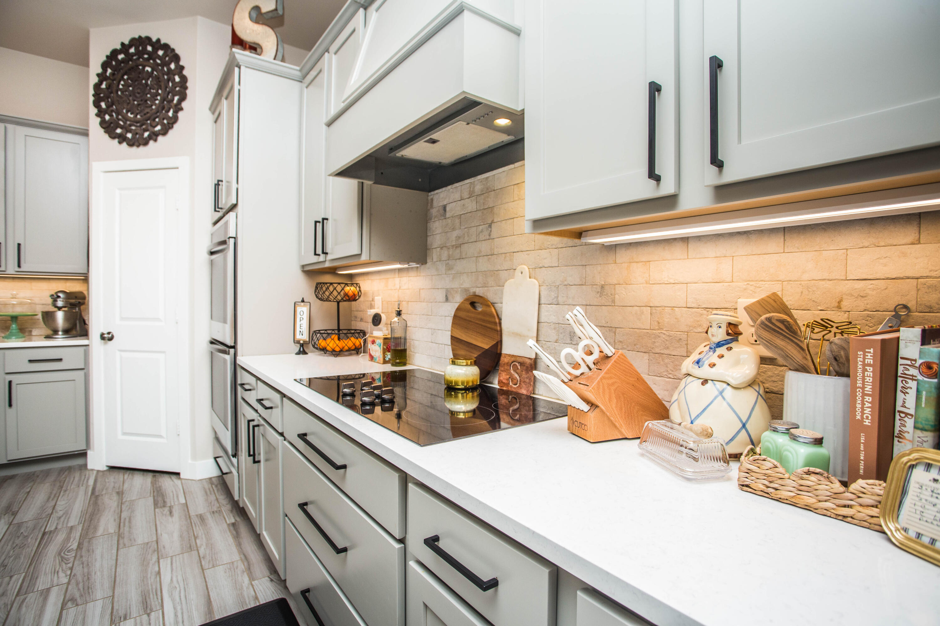 1932 142nd Street Lubbock, TX 79423 - Photo 10 of 38 a kitchen with stainless steel appliances granite countertop a sink and cabinets