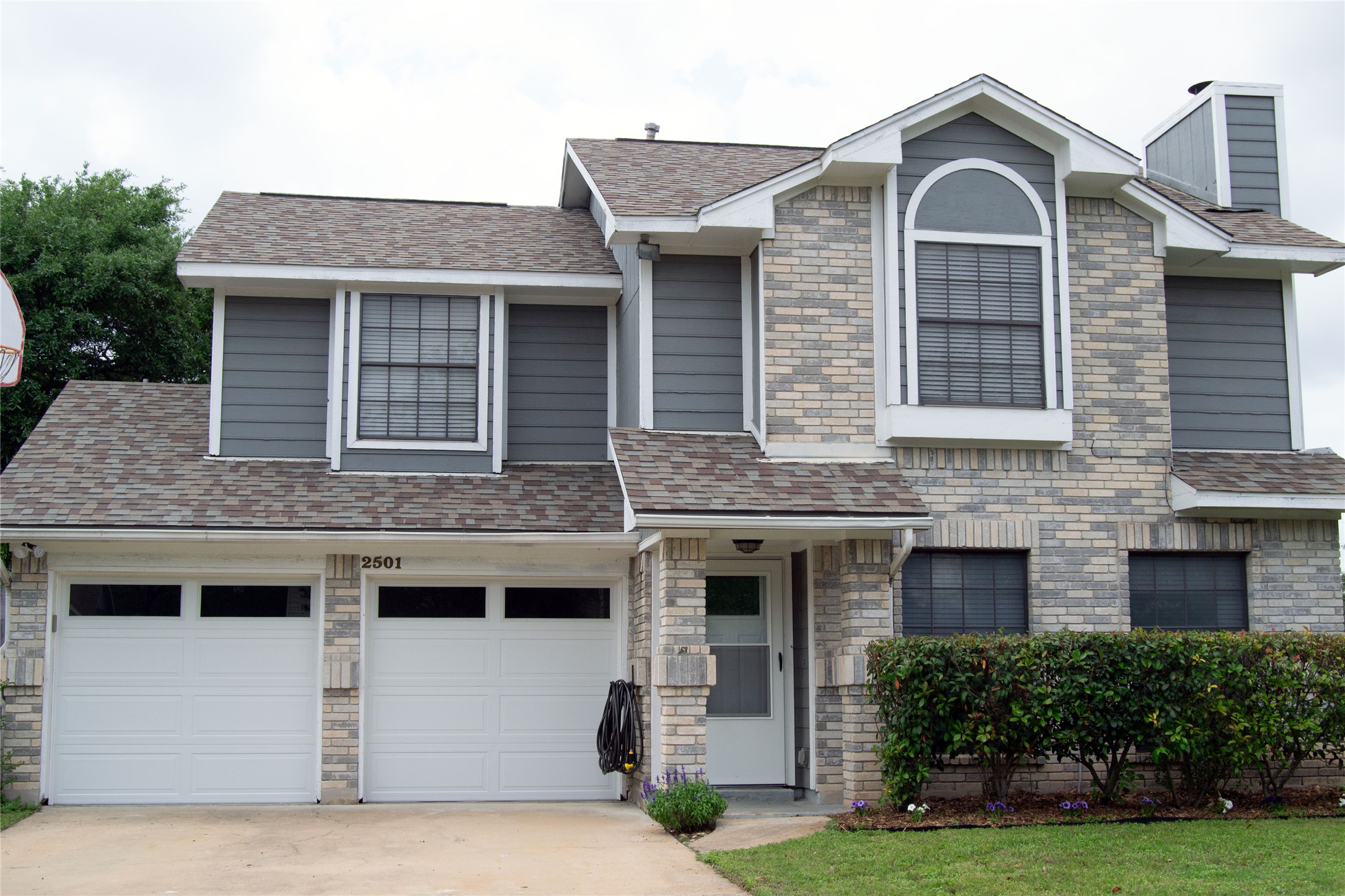 2501 Autrey Drive Leander, TX 78641 - Photo 1 of 27 a front view of a house with yard and garage