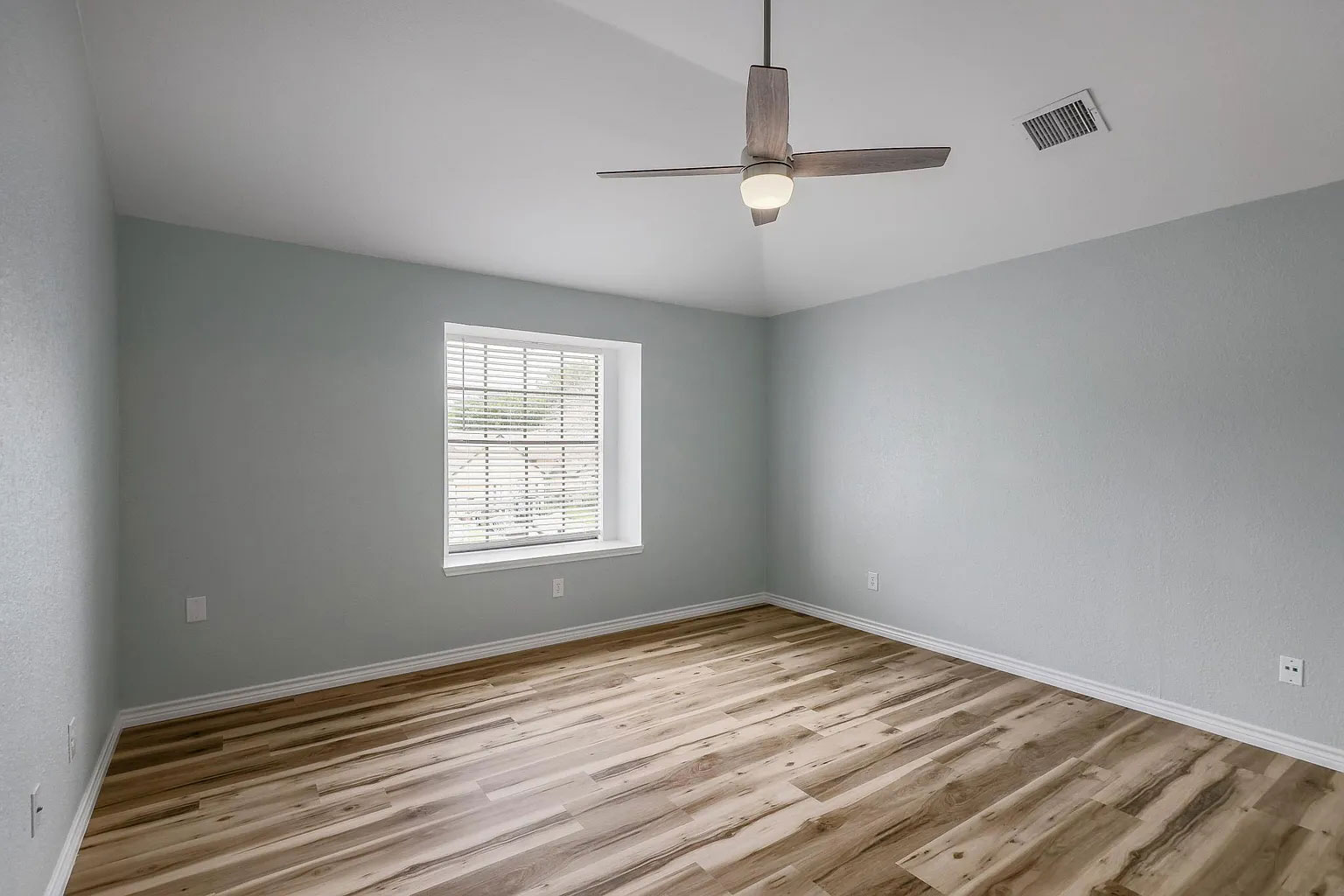 2501 Autrey Drive Leander, TX 78641 - Photo 15 of 27 a view of empty room with wooden floor and fan