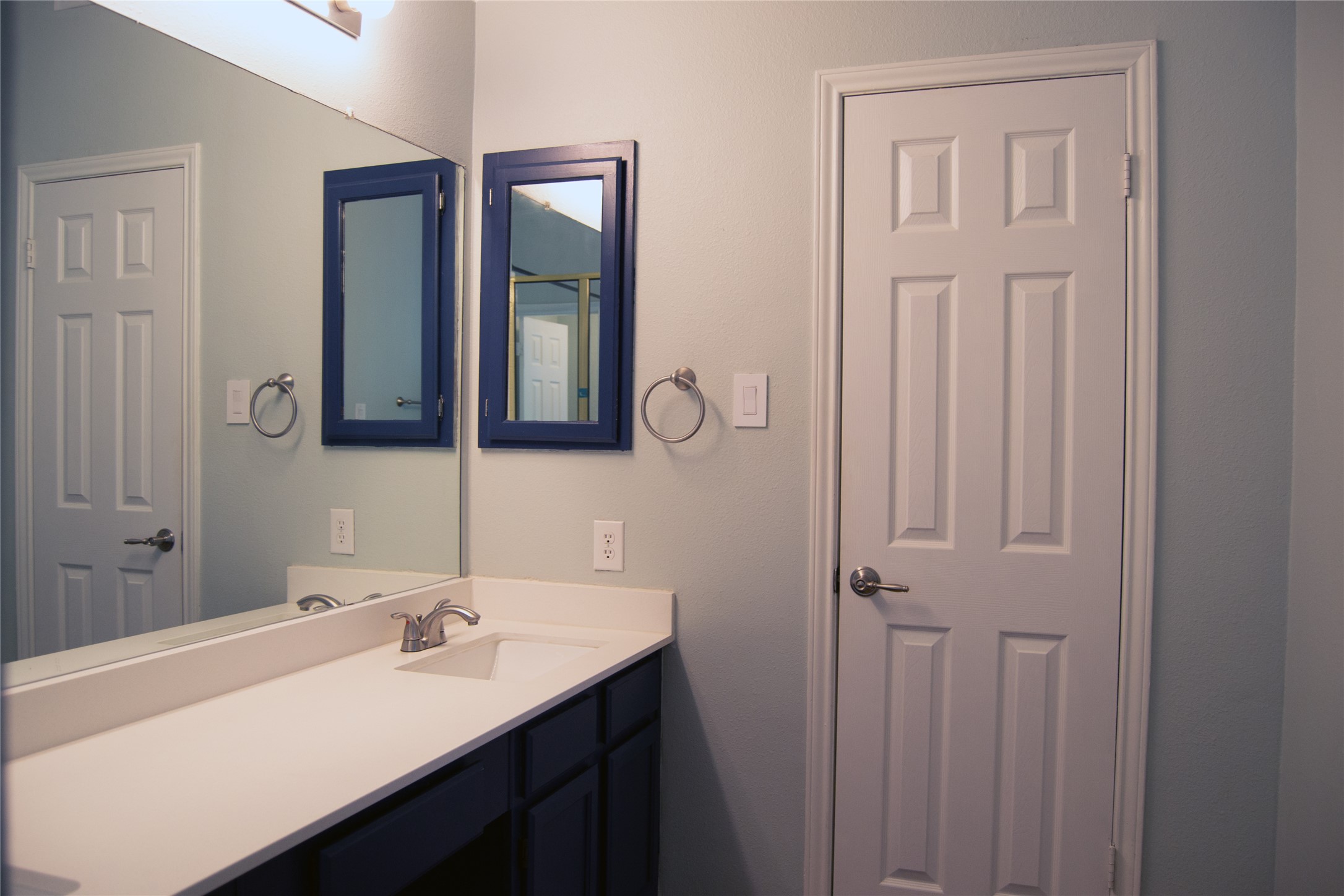 2501 Autrey Drive Leander, TX 78641 - Photo 19 of 27 a bathroom with a sink vanity and mirror